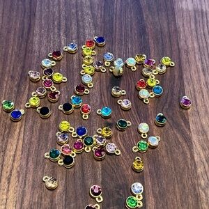 Colorful sparkly gold colored Charms for jewellery making or crafts